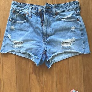 Madewell distressed faded denim shorts.